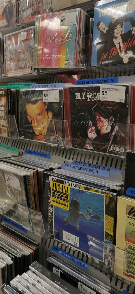 punk, rock, metal cd's in music store 2000s Punk Rock Aesthetic, 2000 Rock Aesthetic, 2000s Rock Aesthetic, Metal Music Aesthetic, Music Store Aesthetic, Cd Collection Aesthetic, Punk Rock Bedroom, Cds Aesthetic, Cd Display