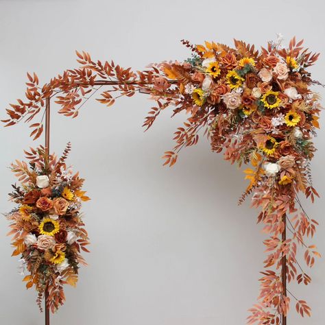 Embrace the enchanting hues of autumn with our stunning floral arrangement, perfect for adding a touch of warmth and elegance to any wedding or event. 🌻🍂 #FlowerArrangement #flowersarch #archdecor #Arches #sunflowers🌻 #sunflowerswedding #artificialflowers #fauxflowerarrangement #summerwedding #fallarch #fallwedding #weddindflorist #weddingvendor Pergola Flowers, Wedding Arbor Flowers, Archway Flowers, Fall Wedding Boho, Arbor Flowers, Pineapple Cupcake, Archway Decor, Wedding Pergola, Arch Arrangement