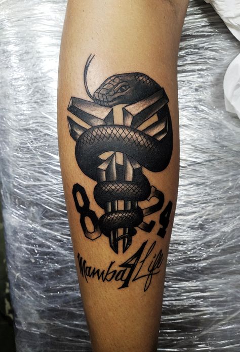 Tattoo in black and white snake mamba in homage to cove bryant his logo and his player number Kobe Tattoo Black Mamba, Mamba Snake Tattoo, Mamba Mentality Tattoo, Black Mamba Tattoo, Mamba Snake, Black And White Tattoo, Black And White Snake, White Snake, White Tattoo