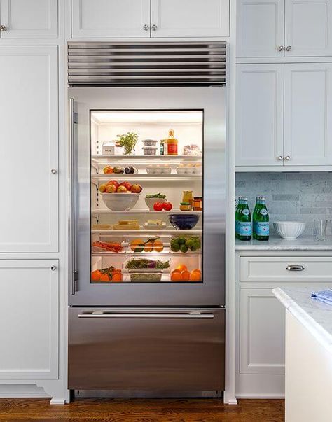 As you can see, it isn’t too hard to fit cabinets around the refrigerator in an efficient way! More decor and other interesting ideas at hackthehut.com Glass Front Refrigerator, Glass Door Fridge, Glass Door Refrigerator, Glass Fridge, Fitted Cabinets, Stainless Steel Fridge, Glass Refrigerator, Kitchen Pantry Cabinets, Apartment Therapy