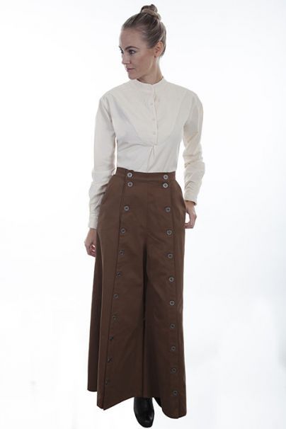 THIS IS A PREMIUM SPLIT RIDING SKIRT FOR EVERY WESTERN WOMAN. This authentic split riding skirt is made of a soft brushed twill cotton and has large pewter buttons down each side with open side entry pockets. Split Riding Skirt, Armor Jewelry, Riding Skirt, Costume Armour, Western Women, Reading Shirts, Contemporary Clothing, Historical Costume, Contemporary Outfits