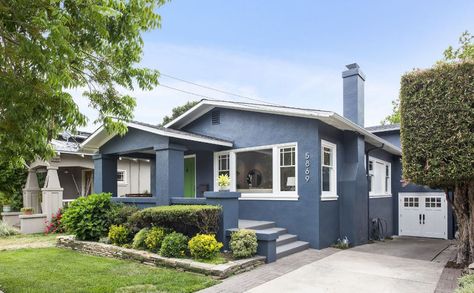 Blue Gray Stucco House Exterior, 1920s Stucco House Exterior, White Stucco House With Blue Trim, Stucco Bungalow Exterior, Dark Blue Stucco House Exterior, Blue House Exterior Stucco, Blue Stucco House Exterior, Light Blue Stucco House Exterior, Stucco Small Homes