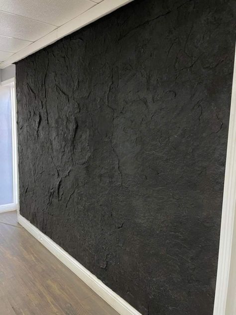 Modern Industrial Accent Wall, Rock Wall Shower Ideas, Concrete Wall Design Interior, Faux Rock Wall Interior Living Room, Custom Feature Wall, Concrete Accent Wall Living Rooms, Textured Walls Black, Fireplace Wall Panel, Black Textured Wall Paint