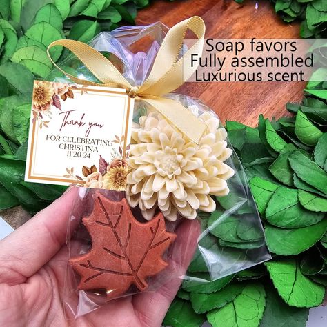 Fall soap favors Give your event a personal touch with our personalized favors! Your guests will love these adorable soap favors! --- Hand poured shea butter soaps scented with essential oils --- Each favor is individually wrapped and includes a personalized tag, satin bow --- Satin bow color will match soap color choice -- Each bag contains two soaps- one leaf and one flower. Leaf soaps will be a variety of leaf shapes.  --- Available in six scents: please refer to listing photos for scent desc Fall In Love Bridal Shower Favors, Fall Bridal Shower Party Favors, Bridal Shower Guest Gift Ideas, Fall Party Favors For Women, Fall Bridal Shower Favors, Fall Party Favors, Fall Wedding Favors, Unique Bridal Shower Favors, Fall In Love Bridal Shower