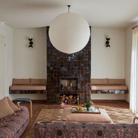 Cork Floors and Iridescent Tiles Breathe New Life Into a 1970s Bungalow in England | Architectural Digest Tiled Fireplace, French Farmhouse Dining Table, Iridescent Tile, Ivory Curtains, Antique Dining Tables, Zellige Tile, Cork Flooring, Wooden Mirror, Room Redo