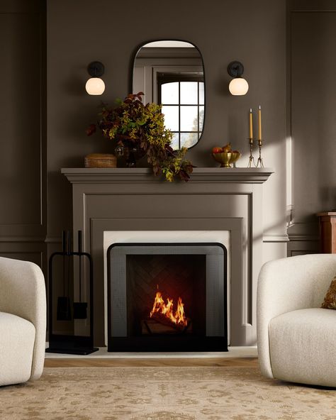 Make the fireside the focal point in your room with hearth accessories, soft lighting, and a decorative mirror. Flat Fireplace, Above Fireplace Ideas, Above Fireplace Decor, Modern Fireplace Tools, Sconces Fireplace, Light And Dwell, Fireplace Lighting, Fireplace Tool Set, Fireplace Screen