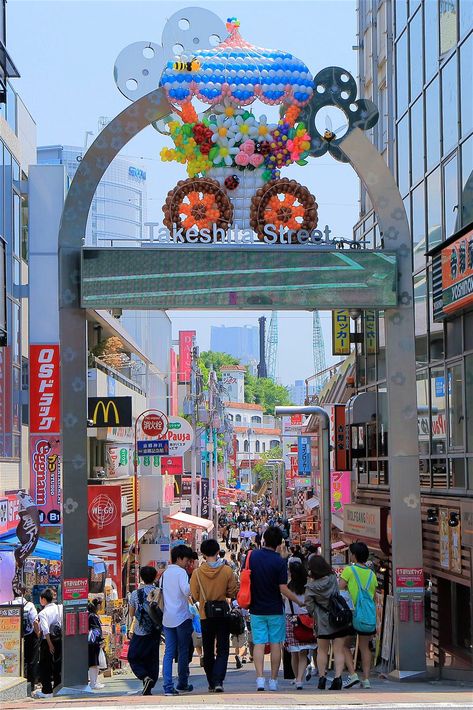 People walk down Takeshita shopping street in Harajuku, Tokyo Tokyo Neighborhoods, Takeshita Street, Best Places To Shop, Tokyo Shopping, Harajuku Tokyo, Harajuku Street, Shop Sign Design, Places To Shop, Neighborhood Guide