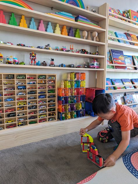 For displaying collection like wooden pegdolls, Hot Wheels and Pixar Cars, Matchbox cars (toy cars of scale 1:64) Designed with our Slim-line Toy shelf with 7 tier for the true enthusiast in mind, this display shelf offers a perfect blend of style and functionality. (Bottom tier) Spacious Design: Holds up to 60 Hot Wheels cars, giving each one a place of prominence. Durable Construction: Made from solid pine wood to ensure long-lasting use and stability. Sleek Aesthetic: With its modern design a Toy Car And Truck Organization, Toy Car Wall Display, Lego Hobby Room, Hot Wheel Displays Ideas, Hot Wheels Set Up, Toy Garage Diy, Hotwheel Display, Hot Wheels Storage Ideas, Hot Wheels Storage Display