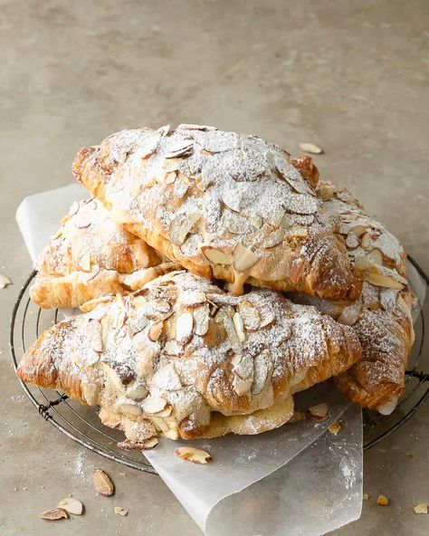 Almond croissants are an easy to make version of the classic french pastry, croissants aux amandes. This quick almond croissant recipe uses day old store bought croissants, filled with a homemade almond pastry cream, topped with a sweet almond syrup. Skip the fancy french bakery and make these buttery almond filled croissants for the perfect breakfast or brunch treat. French Crissonts Recipe, St Martins Croissant, Fancy Croissant Recipe, Almond Crescent Rolls, Almond Croissants Recipe, Healthy Breakfast Pastry, Almond Crossiant Recipes, Almond Filling For Croissants, Almond Croissant Aesthetic