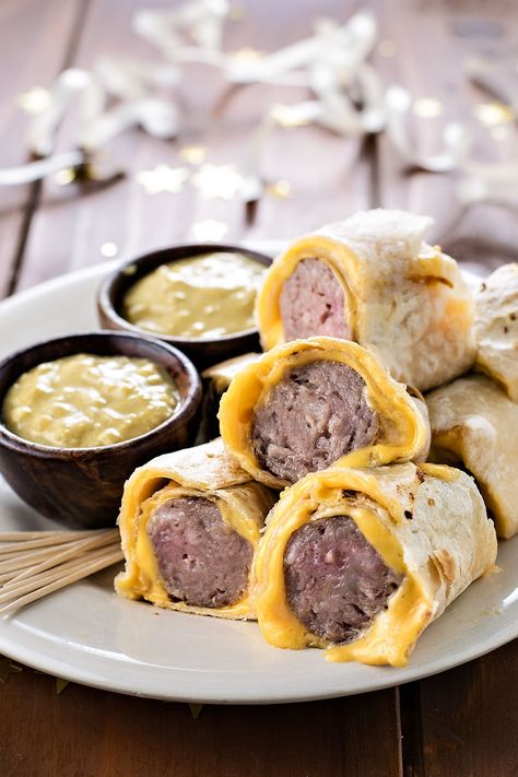 Tortilla Wrapped Bratwursts with Beer Mustard! A unique and trendy appetizer that's the perfect finger food for all the meat lovers at your next party! | HomemadeHooplah.com #gotortillaland #partyfood #spon Beer Bratwurst Recipes, Beer Mustard Recipe, Tortilla Cheese, Beer Bratwurst, Brats Recipes, Pork Chop Casserole, Beer Mustard, Bratwurst Recipes, Mustard Recipe