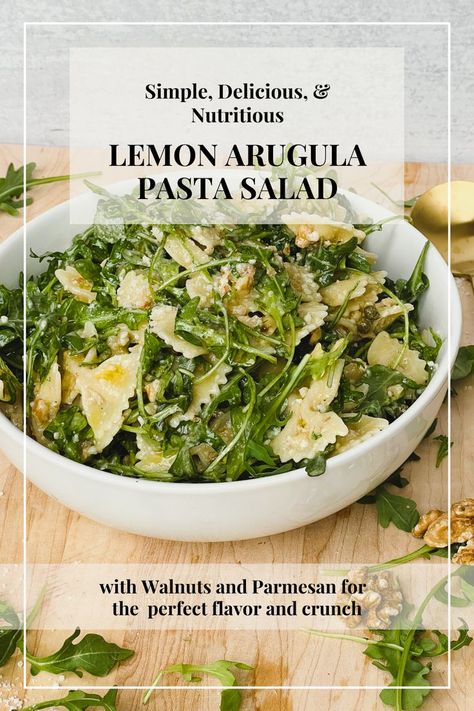 background image shows white bowl containing lemon and arugula pasta salad with bowtie shaped pasta. It sits on a light brown cutting board. Text overlay reads "Simple, delicious, and nutritious Lemon Arugula Pasta Salad with Walnuts and Parmesan for the perfect flavor and crunch." Lemon Arugula Pasta, Weird Thanksgiving, Arugula Pasta Salad, Arugula Pasta, Lemon Diet, Rachel Green, Holiday Food, Arugula, Delicious Salads