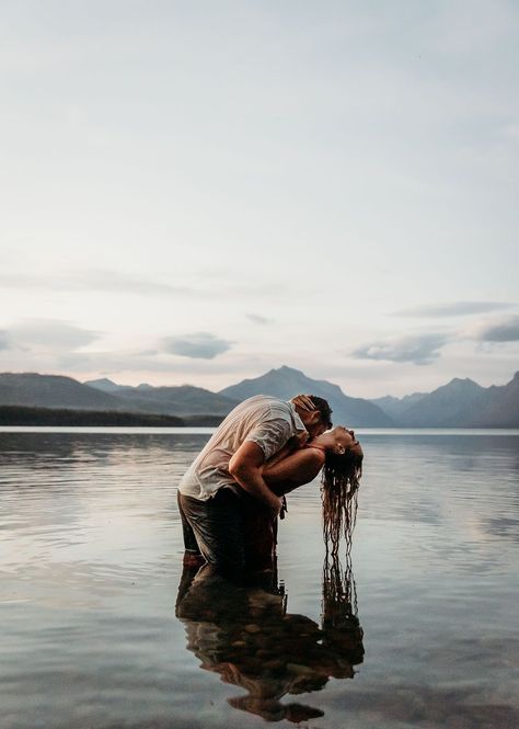 Outdoor Engagement Photos in Lake McDonald | Couples Pose Ideas | Montana Photographer. Whether it's a sunset dip in Lake McDonald or a relaxed lakeside stroll, you will have breathtaking photos to mark this special time in your life. See engagement photos near lake, lake engagement outfits, national park engagement photos and steamy engagement. Book Brogan for your outdoor western engagement session at photographybybrogan.com. Couples Photo Shoot In Water, Diablo Lake Engagement Photos, Duluth Engagement Photos, In The Lake Photoshoot, Romantic Lake Photoshoot, Couples In Water, Lake Beach Photoshoot, Couple In The Water, Mountain Lake Engagement Photos