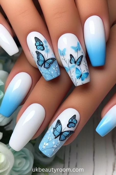 Blue and White Nails with Butterflies - Blue is a popular color in nail art because it has many shades and looks great on all skin tones. This post lists 43 different blue nail designs that showcase the versatility of this color, from subtle pastel blues to vibrant royal blues, providing plenty of inspiration for your next manicure. light, sky, royal, dark, short navy, pastel pink, winter, summer, spring, fall, pink and royal, short royal, acrylic, coffin, almond, simple, square, christmas Blue And White Nails, Swirl Nails, Butterfly Nail Designs, Butterfly Nail Art, Fancy Nails Designs, Blue Nail Art, Blue Nail Designs, Blue Nail, Butterfly Nail