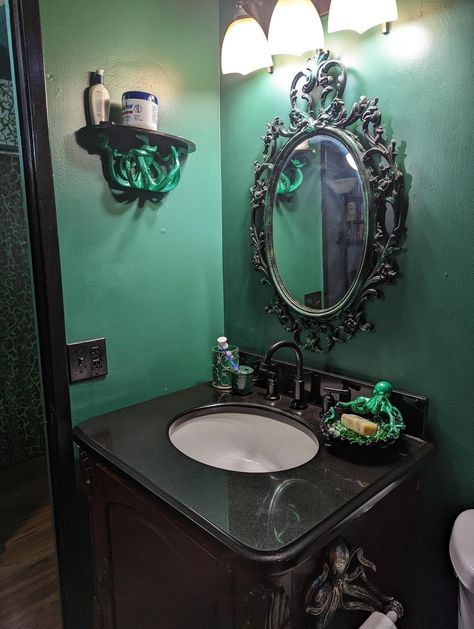 From reddit https://www.reddit.com/r/WitchesVsPatriarchy/comments/wdqr0z/i_love_how_my_bathroom_remodel_turned_out_if_i/ Goblincore Bathroom Aesthetic, Octopus Bathroom Decor Ideas, Dark Mermaid Bathroom Decor, Gothic Nautical Bathroom, Gothic Ocean Bathroom, Gothic Green Bathroom, Victorian Gothic Bathroom Ideas, Goth Nautical Decor, Witchy Bathroom Decor Ideas