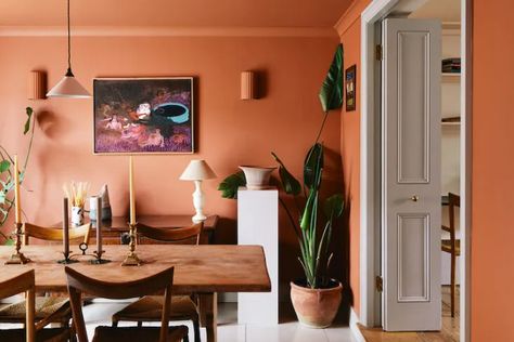 Trending on Remodelista: A Home Without Plants Is . . . - Gardenista Terracotta Dining Room, Orange Dining Room, Terracotta Walls, Plaster Wall Lights, Modernist Furniture, Orange Walls, London House, Dining Room Lighting, Interior Design Studio