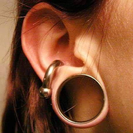 Ear gauges are a good example of an extension of the body's abilities because they stretch the ear Big Gauges Ears Stretched Lobes, Big Conch Piercing, Big Gauges, Stretch Ears, Stretched Ear Lobes, Bat Ears, Types Of Ear Piercings, Dark Blue Hair, Stretched Lobes