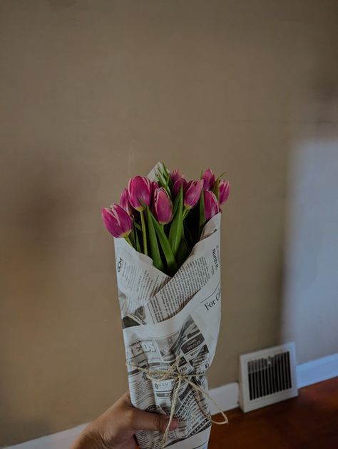 Pink tulips wrapped in a piece of newspaper secured with twine #flowers #tulip #rustic #girlfriend #boyfriend #gift #bouquet #twine #newspaper #justbecause #pink #florals Flowers In Newspaper Bouquets, Newspaper Wrapped Bouquet, Newspaper Wrapped Flowers, Tulips Wrapped In Brown Paper, Flowers Wrapped In Newspaper, Newspaper Flower Bouquet, Valentines Content, Newspaper Bouquet, Newspaper Wrapping