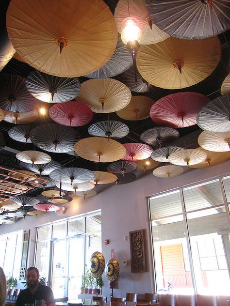 Parasols are such a fun way to decorate for any wedding or event! Find them for rent and /or sale at splendorforyourguests.com!  Splendor for Your Guests | Rental Company | Weddings | Events | Shawls | Blankets | Umbrellas | Parasols | Fans Umbrella Ceiling, Paper Parasol, Umbrella Decorations, Japanese Umbrella, Desk Layout, Paper Umbrellas, The Ceiling, Ceiling Decor, Restaurant Interior