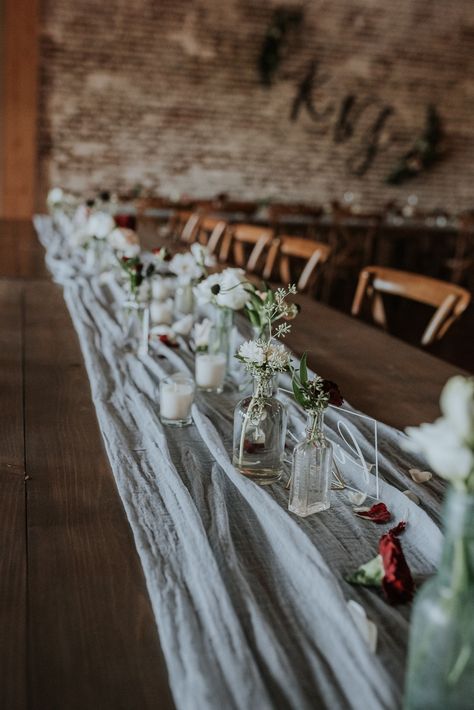 Farm Table With Runner Wedding, No Tablecloth Wedding Tables, Wedding Table Decorations Cheesecloth, Cheesecloth Table Runner With Candles, Simple Wedding Table Decor Without Plates, Simple Table Runner Wedding, Cheesecloth Runner Bud Vases, Cheesecloth Centerpiece Wedding Round Table, Cheesecloth Wedding Decor