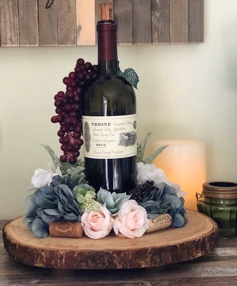 Wine Party Centerpiece Ideas, Wine Bottle And Balloon Centerpieces, Wine Centerpiece Ideas, Wine Bottle Centerpieces For Wedding Diy, Floral Arrangements With Wine Bottles, Wine Centerpieces, Wine Bottle With Flowers Centerpieces, Wine Bottle Centerpieces Diy, Floral Arrangement On Wine Bottle