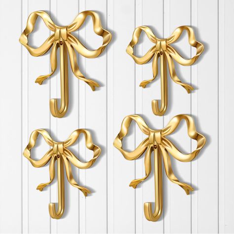 PRICES MAY VARY. Abundance in Every Package: each set includes 4 gold bow knot hooks, giving you a sufficient quantity to meet all your needs; You can share them with family or use them in different rooms Your Ideal Bow Wall Hook: these stunning bow hooks are made of quality brass material which ensures durability and robustness; These brass wall hooks have a strong carrying capacity that can securely hang your items without deterioration; The material is also waterproof, rust proof, and not eas Towel Hooks In Bathroom, Bamboo Nursery, Bow Lamp, Bow Nursery, Wall Decor For Kitchen, Hooks For Bathroom, Bow Wall, Living Room Kitchen Decor, Girly Bathroom