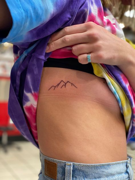 Rib Tattoo Mountain, Mountain Tattoo Side Ribs, Ribcage Mountain Tattoo, Mountain Tattoo Ribcage, Mountain Tattoo On Ribs, Mountain Tattoo Ribs, Mountain Rib Tattoo, Cute Rib Tattoos For Women, Mountain Tattoos For Women