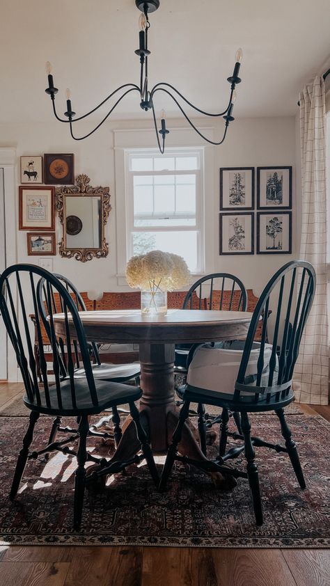 Dining Room Decor Antique, Black Windsor Chairs Dining Room, Dining Room Design Round Table Wood, Black Wooden Dining Chairs, Round Wood Table With Black Chairs, Round Wood Dining Table Black Chairs, French Cottage Dining Room Ideas, Round Table Vintage, Dark Wood Table With Black Chairs