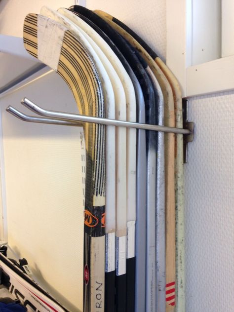 Hockey Stick Storage Ideas, Hockey Stick Organization, Hockey Gear Organization, Hockey Stick Storage Diy, Hockey Stick Holder Diy, Hockey Storage Ideas, Hockey Gear Storage, Hockey Stick Storage, Hockey Equipment Storage