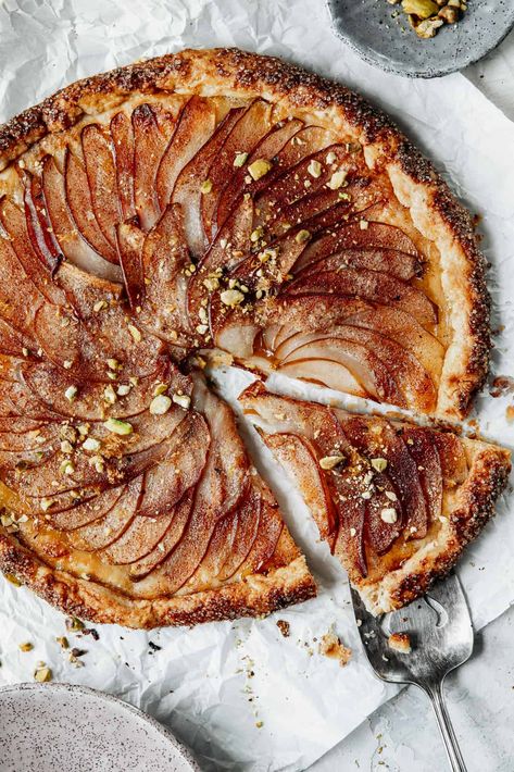 This beautiful (and easy) rustic pear galette nestles juicy pears inside a flaky, buttery crust flecked with cinnamon, sugar, and spicy ginger. Pear Galette Recipe, Pear Gallette Recipe, Cozy Desserts, Galette Recipes, Pear Galette, Whole 30 Dessert, Pear Ginger, Pear Dessert, Sweet Foods