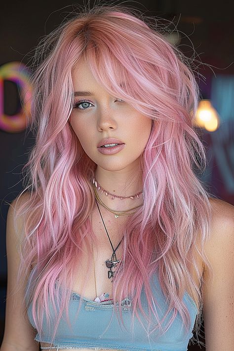 A woman with a pastel pink long shag haircut featuring airy, feather-light layers. Pastel, Pink Shag Hair, Pink Layered Hair, Shag Hairstyle, Long Shag Hairstyles, Shag Hair, Cotton Candy Skies, Long Shag Haircut, Sassy Haircuts