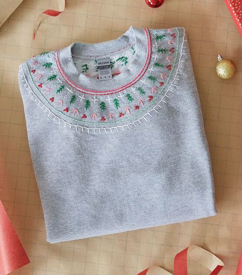 How To Make Holiday Embroidered Sweatshirt Online | JOANN Felt Embroidery Sweatshirt, Sweatshirt Embellishment Ideas, Embroider Shirt Diy, Christmas Sweatshirt Embroidery, Hand Embroidery Christmas Sweatshirt, Hand Embroidered Sweatshirt Ideas, Easy Christmas Embroidery Ideas, Hand Embroidery On Sweatshirts, Sweat Shirt Embroidery