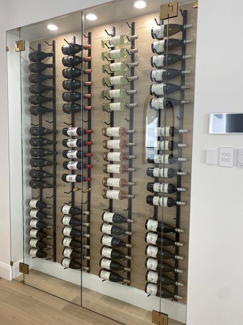 Glass Wine Cooler Wall, Indoor Wine Cellar, Modern Wine Wall Display, Glass Enclosed Wine Wall, Wine Cellar Wall Dining Room, Wine Under Stairs, Glass Wine Wall, Wine Cellar Modern, Wine Cellar Lighting