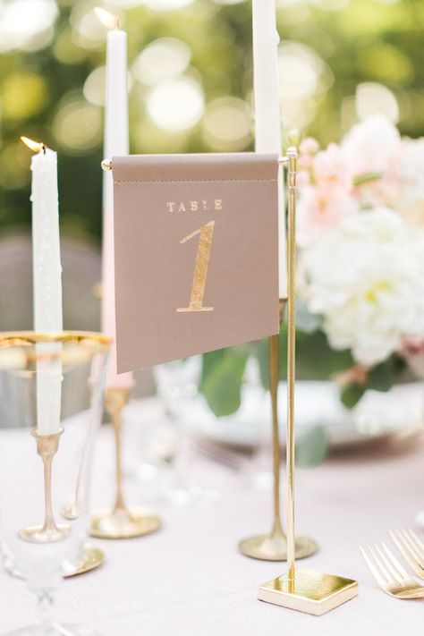 Creative Table Number & Place Card Ideas For Every Wedding Style Tall Table Numbers, Creative Wedding Table Numbers, Unique Table Numbers Wedding, Place Card Ideas, Unique Table Numbers, Wedding Table Number Holders, Table Number Stands, Diy Table Numbers, Gold Table Numbers