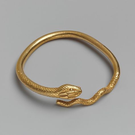 This massive bracelet or armlet is cast in solid gold. The scales and details of the snake's head were chased after casting. Ancient Greek Jewelry, Serpent Jewelry, Ancient Egyptian Jewelry, Ancient Jewels, Roman Jewelry, Ancient Jewellery, Historical Jewellery, Long Pearl Necklaces, Egyptian Jewelry