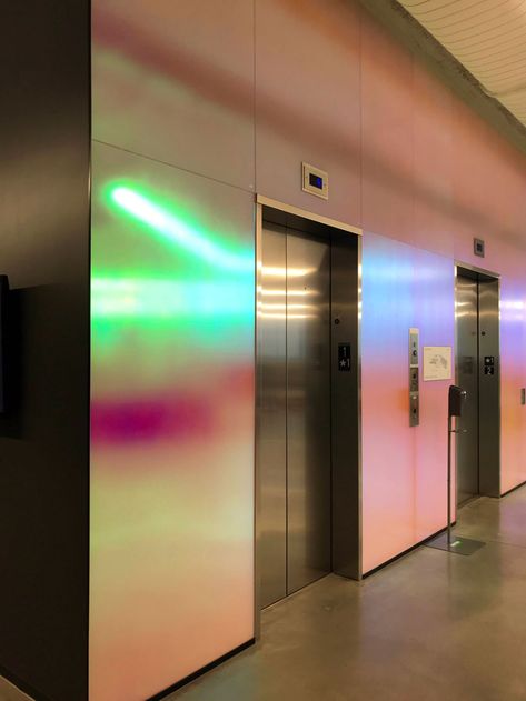 Dichroic Glass Architecture, Elevator Lobby Design, Dichroic Film, Lift Lobby, Aurora Art, Elevator Lobby, Corporate Headquarters, Back Painted Glass, Glass Elevator