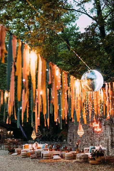 Light Garland Wedding, Creative Wedding Decor Ideas, Boho Ribbon Garland, Cheap Boho Wedding Decor, Festival Wedding Table Decor, Outdoor Festival Decorations, Festival Vibe Wedding, Summer Festival Decorations, Eclectic Wedding Ceremony Decor