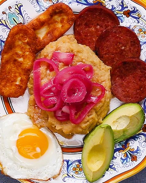 Mangú Con Los Tres Golpes Recipe by Tasty Mangu Recipe, Dominican Breakfast, Fried Salami, Dominican Dish, Dominicano Recipes, How To Cook Plantains, Mashed Plantains, Zucchini Parmesan, Eggs Avocado