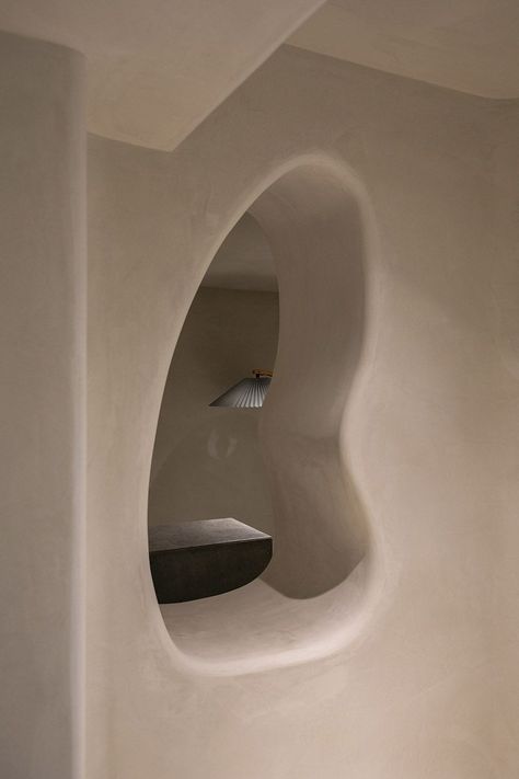 Read the Living In Design journal to explore more about this cave inspired space design. Cave Interior, Interior Design Spaces, Concrete Effect Paint, 70s Interior, Indirect Lighting, Floor Colors, Single Person, Photoshop Design, Earthy Colors