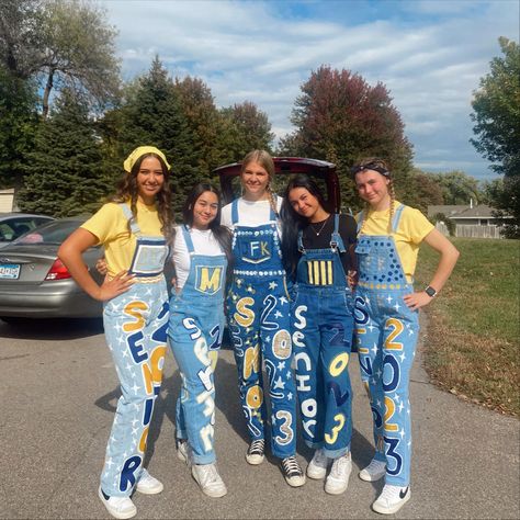 Homecoming Jeans Blue And Gold, Grad Coveralls Ideas, Black Senior Overalls, Blue And Gold Senior Jeans, Black And Gold Senior Jeans, Painted Overalls Senior Year, Senior Overalls Shorts, School Overalls Spirit, Senior Jeans Blue And Gold