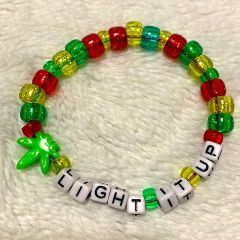 Handmade Word Kandi -This Listing Is For The One Bracelet Pictured Above. Cute Rasta Colors With A Handmade Leaf Charm One Size Fits Most Stretchy Cord Unique And Fun For Your Next Rave Or Festival! Bundling Is Going To Get You The Best Deal So Check Out My Closet For More Kandi Goodies! Edm Edc Raver Pot Stoner Weed 420 Party Kandi Bracelets Jewelry Beads Plur Glitter Outfit Accessories Rainbow Y2k 90s Neon Trippy Rave Candy Bracelets Edm, Candi Ideas Rave, Plur Bracelets Kandi, Kandi Raver Outfits, Ptv Bracelet, Rave Kandi Bracelets Ideas, Rave Trinkets, Clowncore Jewelry, Jamaica Bracelet