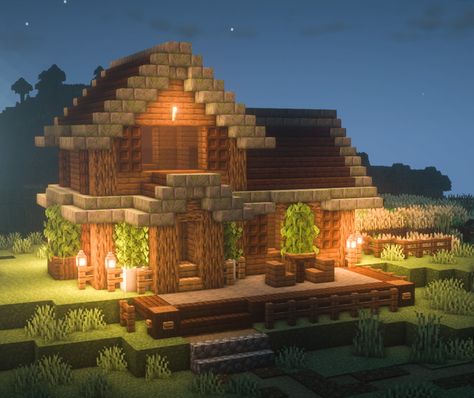 Minecraft Survival house with wheat farm and patio. This will become a village home later on. BSL Shaders BetterLeaves Addon Cozy inspiration #minecraft Minecraft Survival House, Survival House, Minecraft Interior, Minecraft Survival, Minecraft Houses, At Night, Minecraft