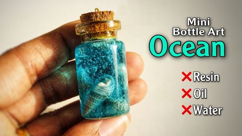 Mini Glass Jar Earrings, Diy Tiny Glass Bottle Crafts, Diy Ocean In A Bottle, Tiny Bottle Crafts Diy Ideas, Sand In Bottle Ideas, Things To Do With Tiny Glass Bottles, Sea Bottle Art, Ocean In The Bottle, How To Make Ocean In A Bottle