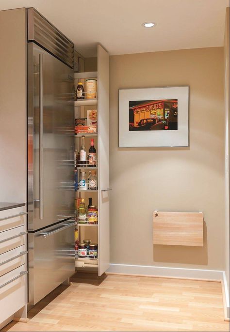 Drawers and pullout pantries, like the one at right, make the most of awkward spaces. They allow easy access to the back of the storage area. Modern Kitchen Pantry, Professional Kitchen Design, Model Dapur, Hidden Pantry, Space Saving Kitchen, Interior Remodel, Yellow Bathrooms, Pantry Design, Stainless Steel Appliances