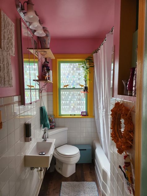 Pink bathroom walls, orange window trim, green window, triangle window clings, bathroom window privacy, 2023 bathroom, bathroom makeover, bathroom update, mounted soap dispenser,  spring vibes Colorful Aesthetic Bathroom, Colorful Bathroom Aesthetic, Small Earthy Bathroom Ideas, Pink Window Trim, Small Quirky Bathroom Ideas, Studio Apartment Bathroom, Funky Bathroom Aesthetic, Pink Ceiling Bathroom, Tiny Colorful Bathroom