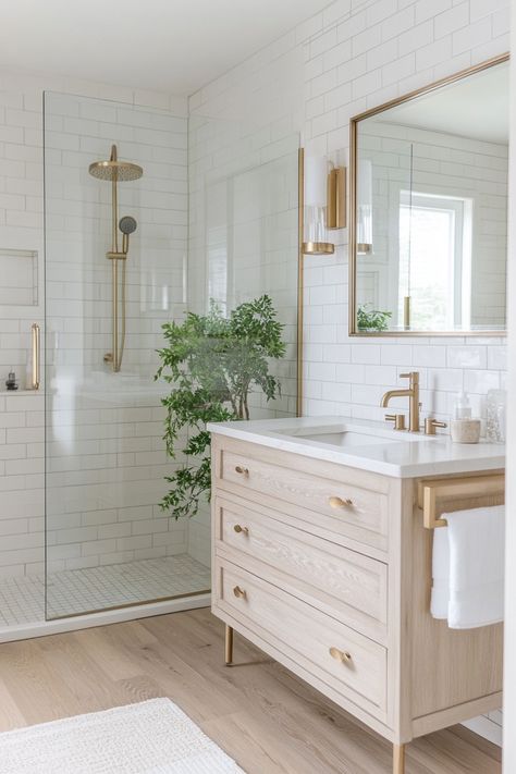 Explore this serene bathroom retreat with trendy brass fixtures and sleek subway tiles. Perfect for those seeking stylish yet functional modern bathroom ideas. #HomeDesign #BathroomDecor #ModernLiving White Subway Bathroom Tile Ideas, White Bathroom Gold Hardware, Bathroom Ideas Brass Fixtures, Gold Bathroom Fixtures, Modern Bathroom Ideas, New House Bathroom, Full Bathroom Remodel, Serene Bathroom, Bathroom Retreat