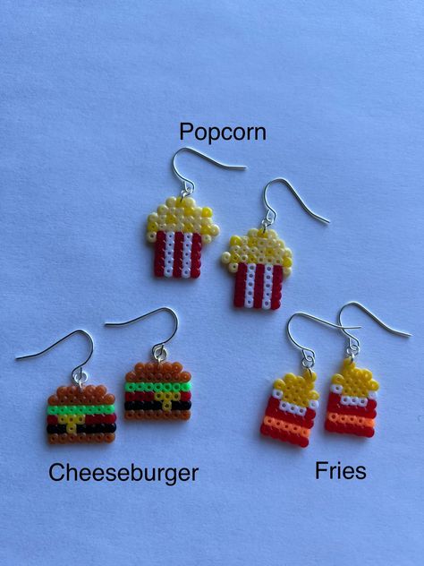 Some of your favourite foods made wearable!  Made with 2.6mm fuse beads on a silver ear wire. Melted Bead Earrings, Melty Beads Earrings, Perler Earing Ideas, Peeler Bead Earring Ideas, Fuse Beads Earrings, Perler Beads Earrings Ideas, Perler Bead Crafts To Sell, Food Perler Bead Patterns, Hama Bead Earrings