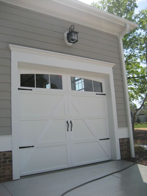 61+ Amazing Garage Door Ideas including One, Two, and Three Door Designs and Sectional, Carriage, Modern, Rustic, and Sliding Door Styles. Walk In Garage Doors, Garage Door Trim, Garage Door Colors, Garage Door Hardware, Modern Garage Doors, Best Garage Doors, Garage Door Styles, Garage Exterior, Garage Door Makeover