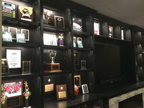 Trophy Shelf Ideas Interior Design, Award Wall Display Ideas, Awards Display Wall, Diploma Display Wall, Trophy Display Ideas, Award Shelves, Trophy Display Shelves, Award Wall, Trophy Cabinets