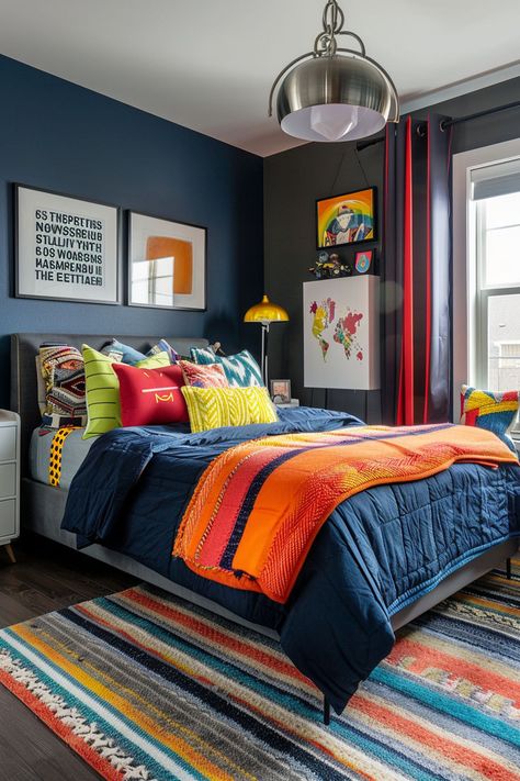 Looking for teen boy bedroom ideas? Create a space that reflects his personality with these awesome decor ideas. From sports-themed designs to modern minimalism, there are plenty of options to choose from. Use colors like navy, gray, and black to create a cool and stylish atmosphere. #teenboybedroom #bedroomdecor #boysroomideas Kid Boy Bedroom Ideas, Boy Bedroom Colors, Black And Blue Boys Room, Teen Bedroom Paint Ideas, Blue And Orange Boys Room, Room Ideas For Teen Boys, Teen Boy Room Decor Ideas, Boys Navy Bedroom Ideas, Blue Bed Ideas