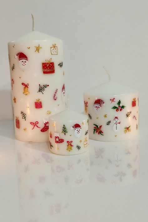 "These candles are hand-painted by me, especially for Christmas. Beautiful Christmas theme candles are perfect for your Christmas table centerpiece.  This listing is for a set of 3 candles. Size: 1)  2*1.5\" 2)  3*3\" 3)  3*5\" Unscented pillar Candles painted with nontoxic high-quality water-based acrylic paints. Each candle is unique and hand-painted by me therefore may vary slightly. Please store candles in a cool and dry place and handle them gently to protect the paint. Keep out of reach of children and never leave a burning candle unattended. Please message me to inquire about the custom order. To see more unique painted candles Please visit: https://artsudiobysb.etsy.com?section_id=45292708 https://artsudiobysb.etsy.com" Acrylic Painting Candle, Cute Christmas Candles, Christmas Themed Candles, Christmas Candles Painting, Christmas Candle Diy, Drawing On Candles, Christmas Painted Candles, Candle Painting Easy, Candle Painting Christmas